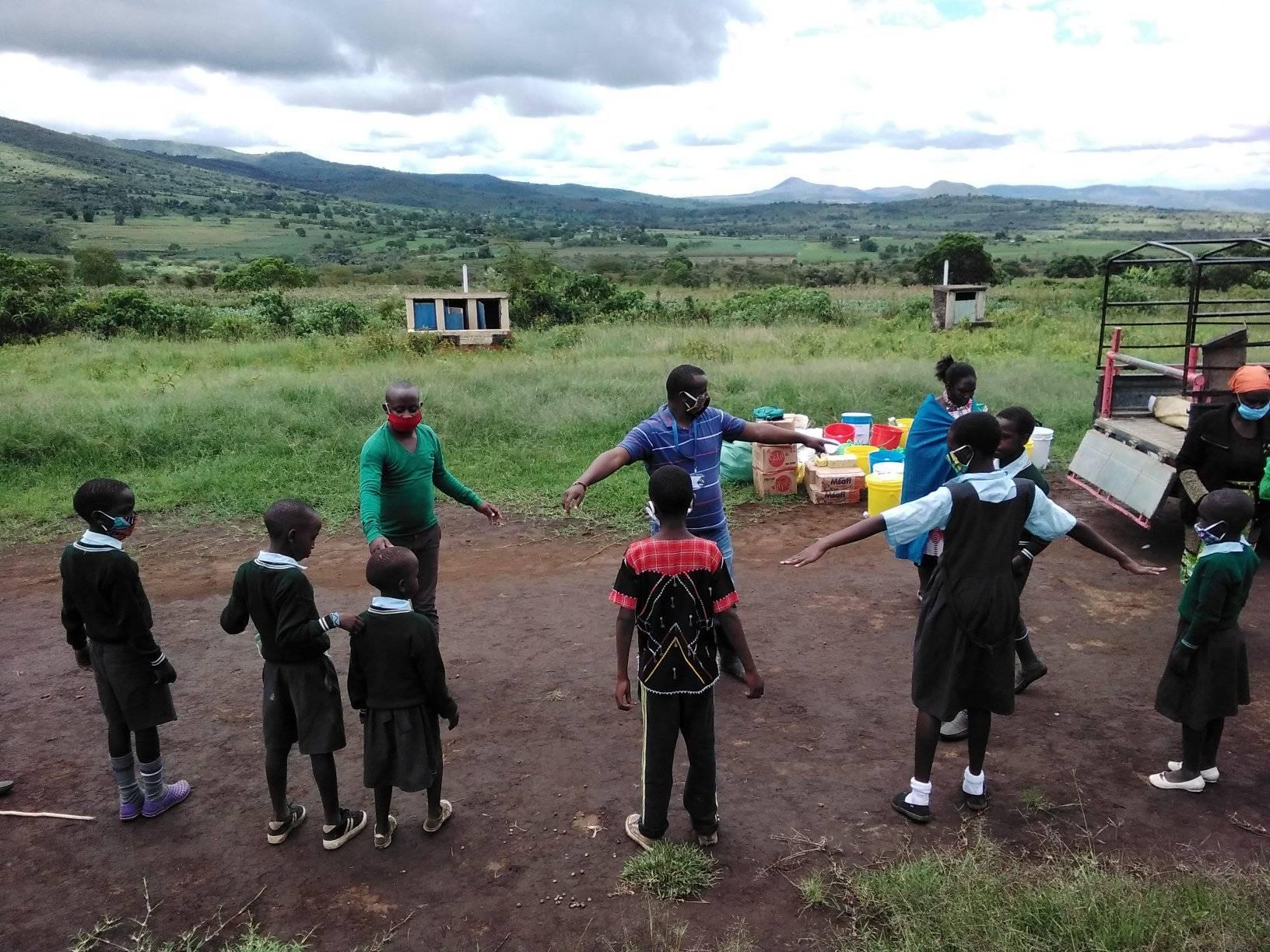 Asante Africa youth sharing information with school kids