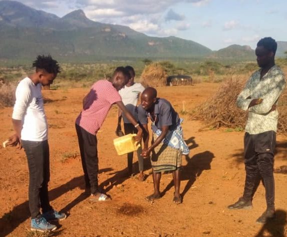 Asante Africa youth washing hands