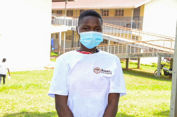 Uganda student wearing mask